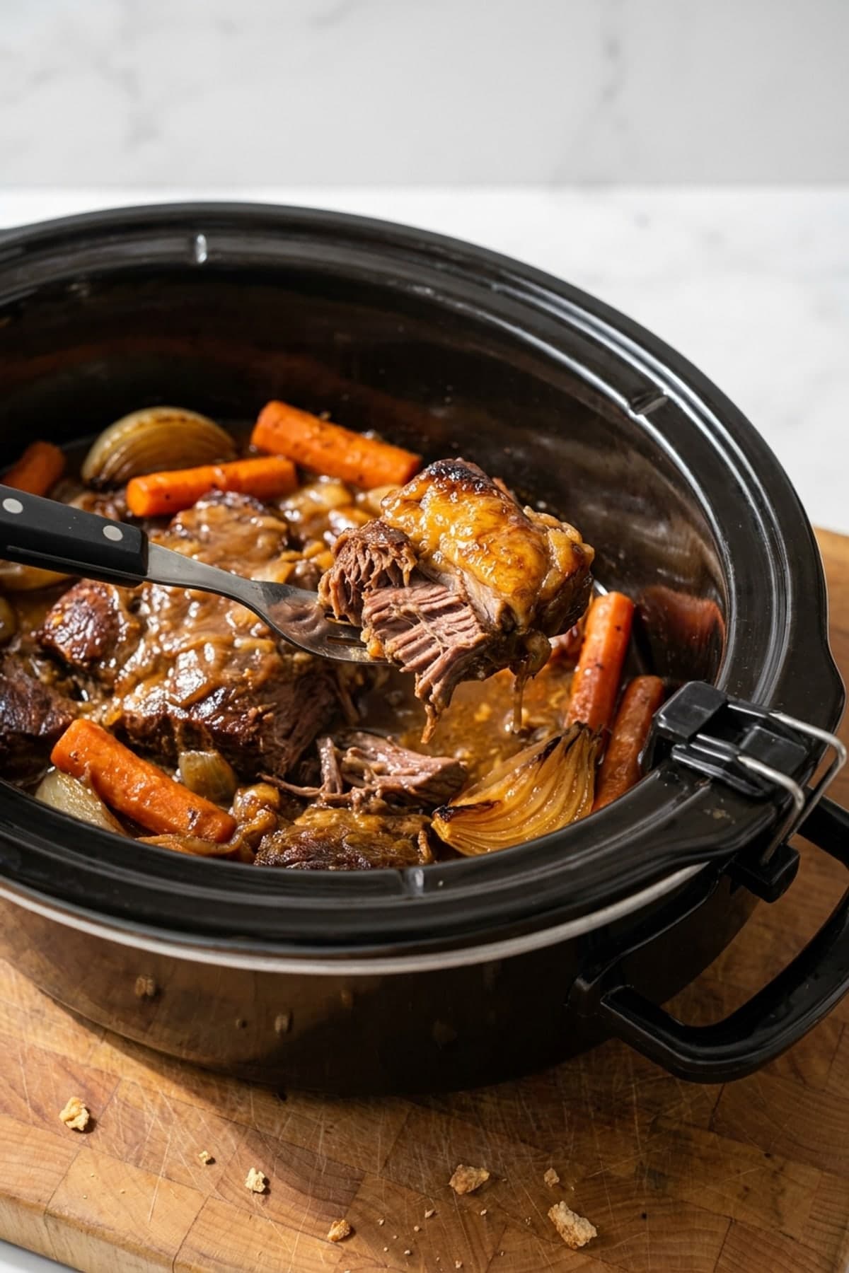 Crockpot Beef Roast with Onion Gravy ready to serve