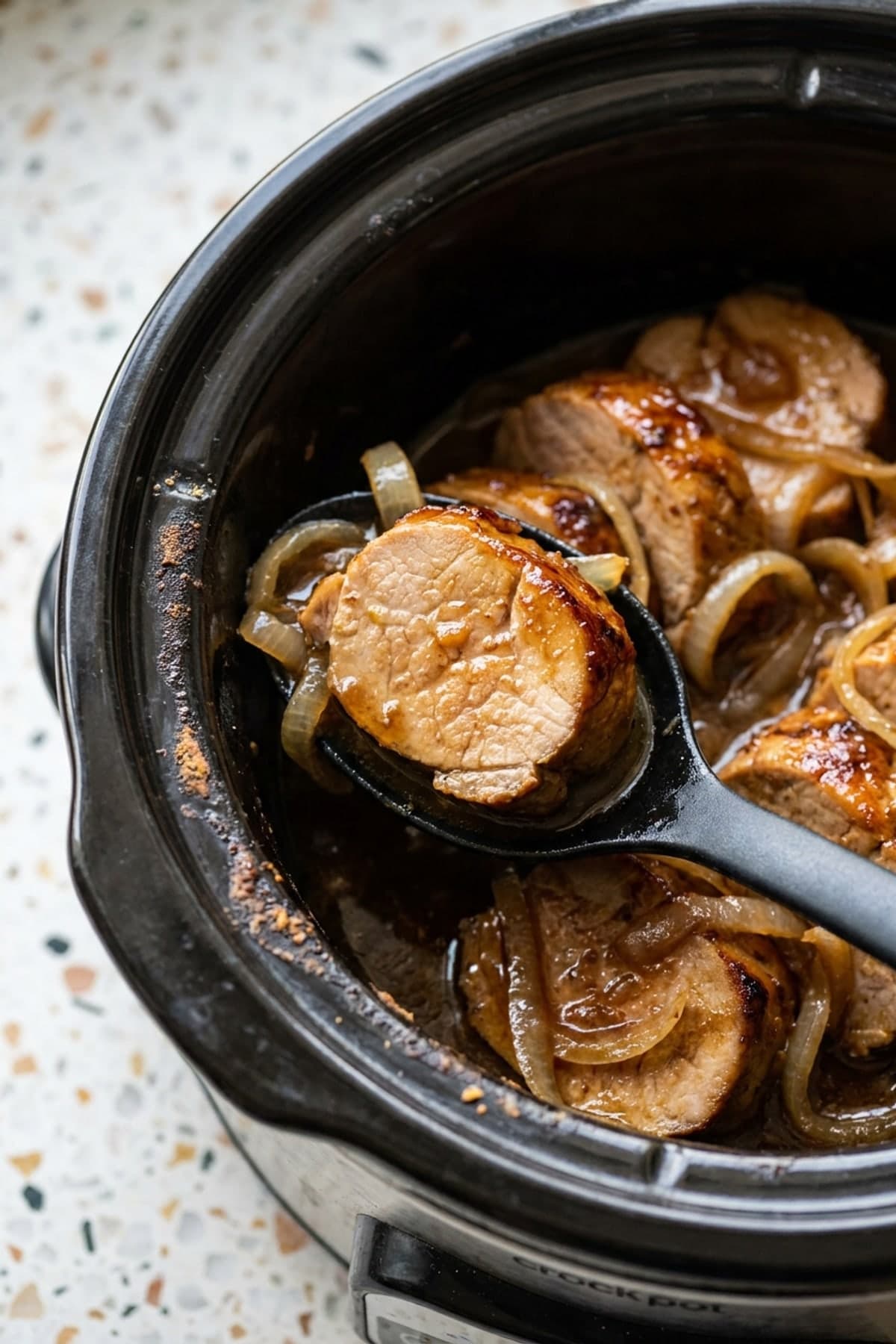 Crockpot Pork Tenderloin with Garlic Gravy ready to serve