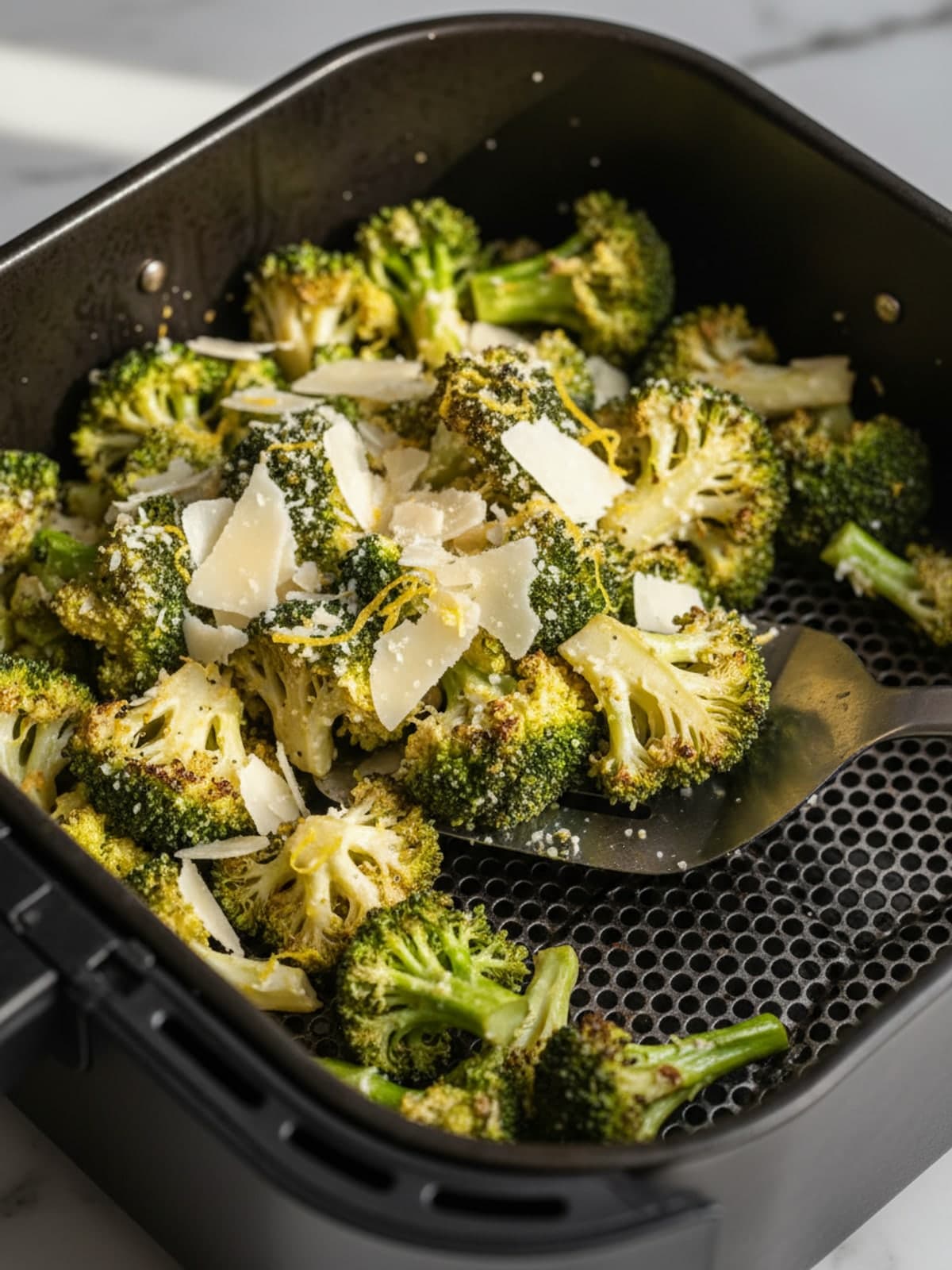 Lemon Parmesan Air Fryer Broccoli: Heat the basket